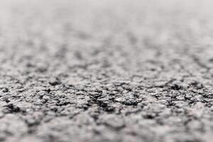 Asphalt Road focused foreground with blurred background. photo