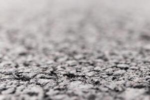Asphalt Road focused foreground with blurred background. photo