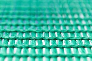 Green wired net surface with blurred background. Advertising bac photo