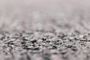 Asphalt Road focused foreground with blurred background. photo