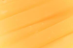 Solid cheese slices macro closeup. Background Texture. photo