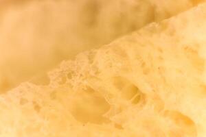 Pulp of bread macro closeup. Texture background. Slice section. photo