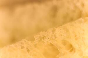 Pulp of bread macro closeup. Texture background. Slice section. photo