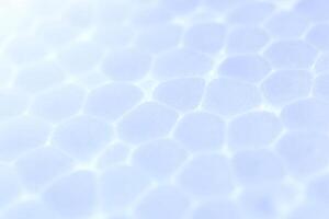 Light Sky Blue Foam Plastic Texture. Abstract Styrofoam Background. Macro Closeup. photo