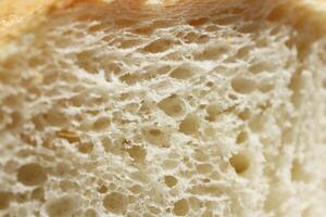 Fresh French Roll Baguette Texture. Bread Crumb Section Slice Food Background. Macro Closeup. photo