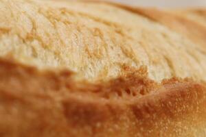 Fresh French Roll Baguette Texture. Crust of Bread Food Background. Macro Closeup. photo