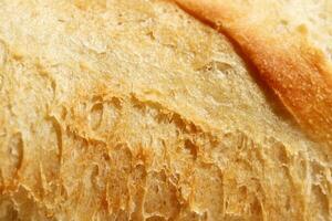 Crust of Bread Food Background. Macro Closeup. photo