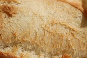 Fresh French Roll Baguette Texture. Crust of Bread Food Background. Macro Closeup. photo
