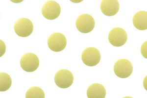 Yellow Isolated Pills Pattern Texture. Medical Tablets Background. Macro Closeup. photo