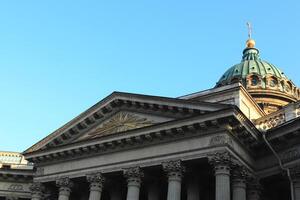 Facade of Kazan Cathedral. Saint-Petersburg. In the center is a silhouette of a shining pyramid. photo