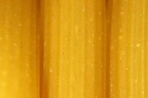 Pasta Texture. Uncooked Macaroni Food Background. Macro Closeup. photo
