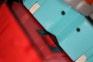 Blue and Red Transformer Toys. Assembled Plastic Construction Background. Macro Closeup. photo