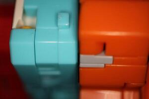 Modern Colored Transformer Toys. Assembled Plastic Construction Background. Macro Closeup. photo