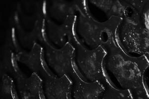 Black Dirty Bicycle Gears Texture. Macro Monochrome Closeup Background. photo