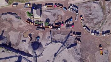Excavator loading crushed stone into a dump truck in a crushed stone quarry video
