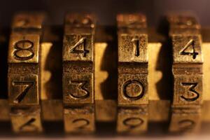 Retro Bronze Lock Number Combination. Shiny Vintage Codes 8414 7303. photo