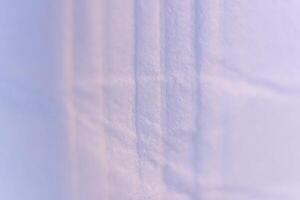 Crumpled Lines on Lilac Paper Texture with Soft Folds. Macro Closeup. photo