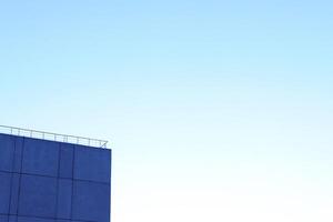 House Corner on Blue Sky Background photo