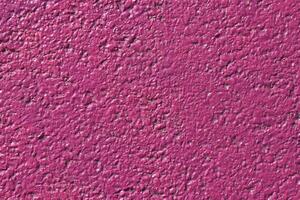 Lilac painted asphalt texture. Colored road surface background. photo