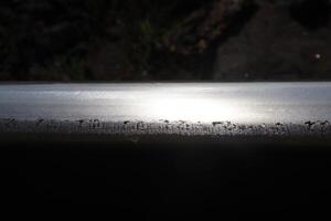 Sun lights Reflection on Steel Rail. photo