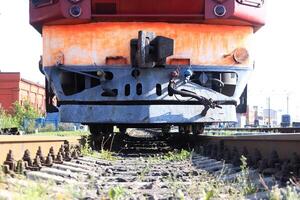 Clearance between train and railways. Train bumper. Train front part. photo