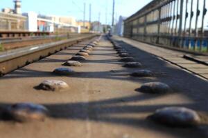 Rusty steel beam with rivets extending into the distance photo