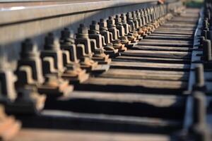 Railway coupling bolts leaving into the distance. Perspective. photo