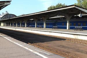 Railway station platform with iron canopy construction. photo