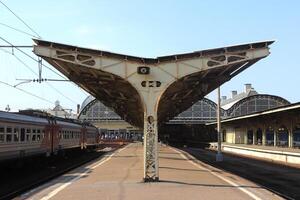 Iron canopy construction on the railway station platform. photo