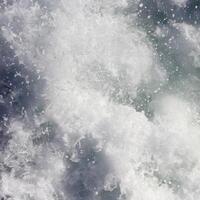 Sea wave foam texture. Marine aqua motion surface background. Outdoor water froth swirls backdrop. photo