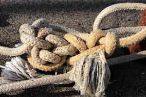Rope knots on the beach photo