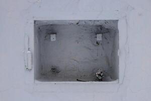 Hole in the building with metal structures photo