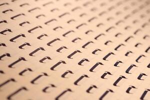 Lettering practice writing worksheet. Handwriting symbol filling pattern. Calligraphic letter C learning skills paper page. Calligraphy letters C background. photo