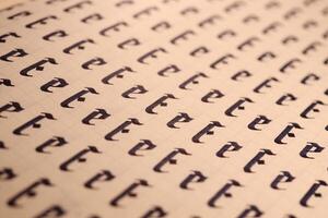 Handwriting symbol filling pattern. Calligraphic letter E learning skills paper page. Calligraphy letters E background. Lettering practice writing worksheet. photo