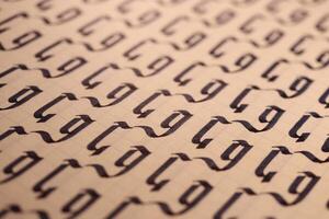 Lettering practice writing worksheet. Handwriting symbol filling pattern. Calligraphic letter G learning skills paper page. Calligraphy letters G background. photo