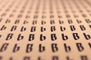 Calligraphic letter B learning skills paper page. Calligraphy letters B background. Lettering practice writing worksheet. Handwriting symbol filling pattern. photo