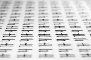 Calligraphy black and white letters H background. Lettering practice writing worksheet. Handwriting symbol filling pattern. Calligraphic letter H learning skills paper page. photo