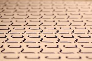 Lettering practice writing worksheet. Handwriting symbol filling pattern. Calligraphic letter J learning skills paper page. Calligraphy letters j background. photo