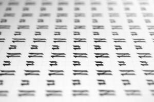 Handwriting black and white symbol filling pattern. Calligraphic letter N learning skills paper page. Calligraphy letters n background. Lettering practice writing worksheet. photo