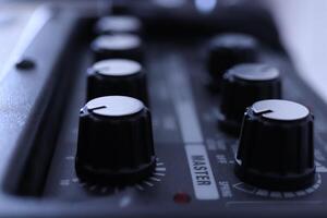 Music instruments control knob row background. Musician lifestyle instrument backdrop. photo
