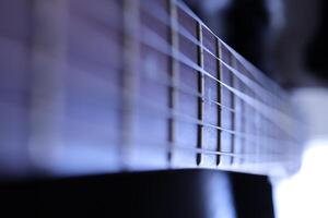 Guitar strings macro closeup. Music instruments background. Musician lifestyle instrument backdrop. photo