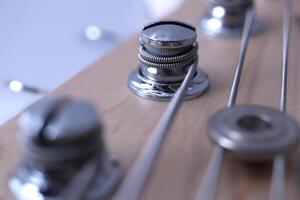 Holding string guitar tuning keys macro closeup. Music instruments background. Musician lifestyle instrument backdrop. photo