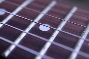 Guitar strings macro closeup. Musician lifestyle instrument backdrop. Music instruments background. photo