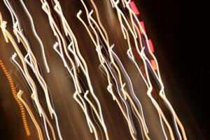 Trail lines background. Traffic bright lamps tracks. Road light traces. photo