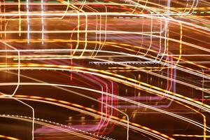 Trail lines background. Traffic bright lamps tracks. Road light traces. photo