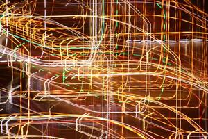 Traffic bright lamps tracks. Road light traces. Trail lines background. photo
