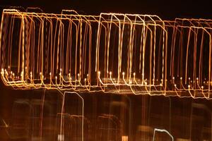 Trail lines background. Traffic bright lamps tracks. Road light traces. photo