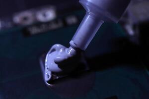 Applying thermal paste to the processor microchip. photo
