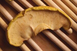 Apple slice are dried on wood sticks. Macro closeup. photo