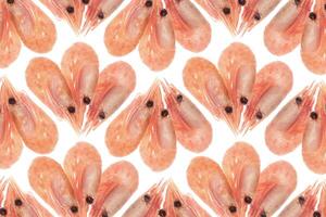Cooked prawns snack pattern. Isolated boiled shrimps background.Cooked prawns snack pattern. Isolated boiled shrimps background. photo
